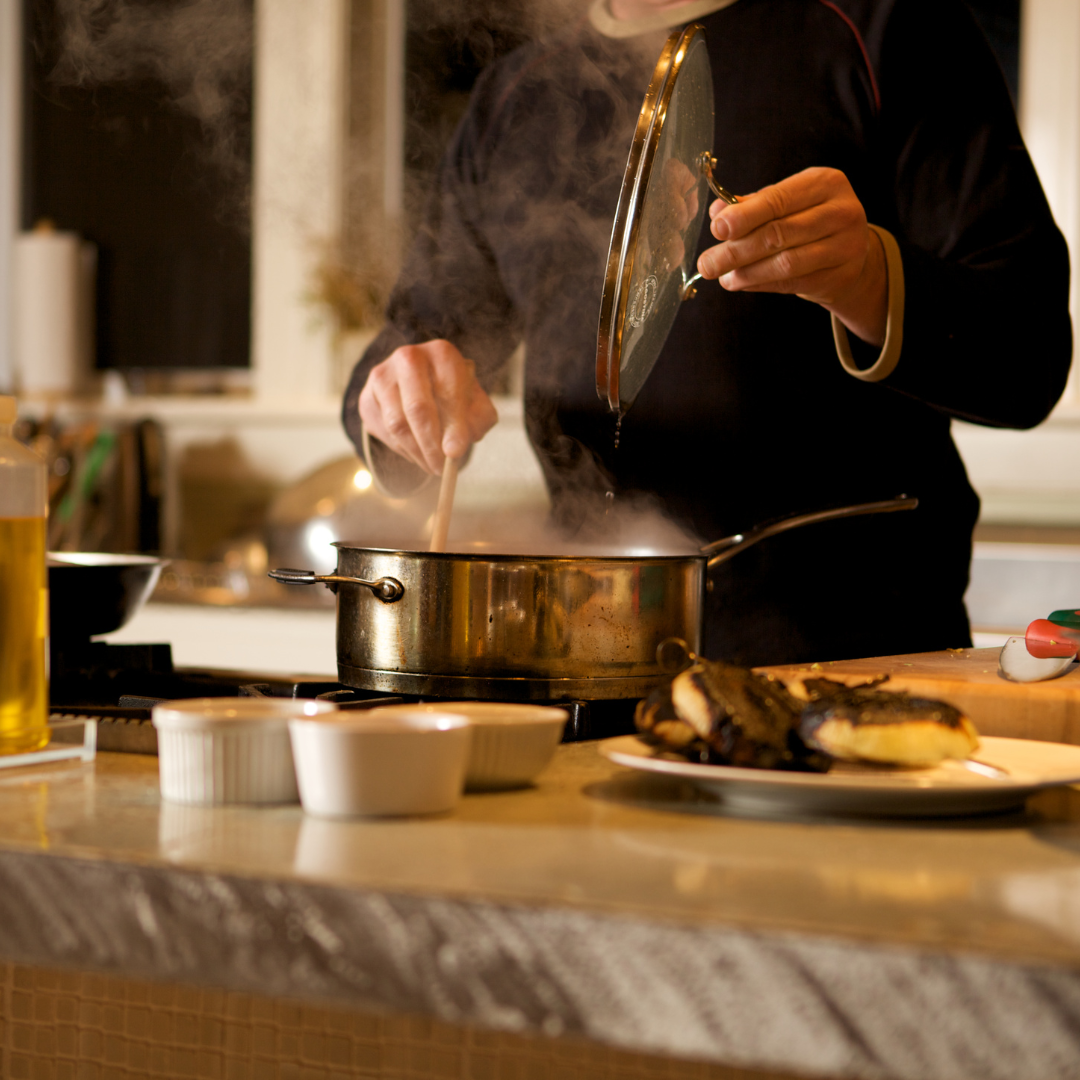 At home chef example with pots and pan on stove.